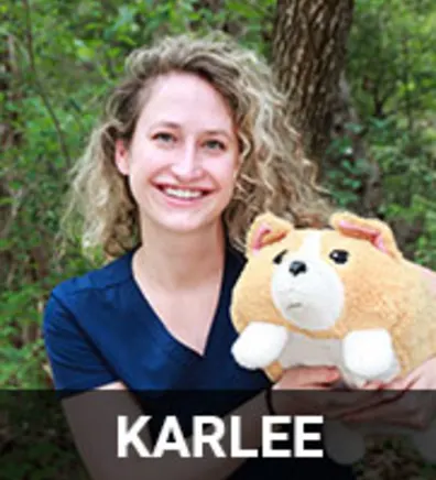 Karlee Holding a Dog Plushy